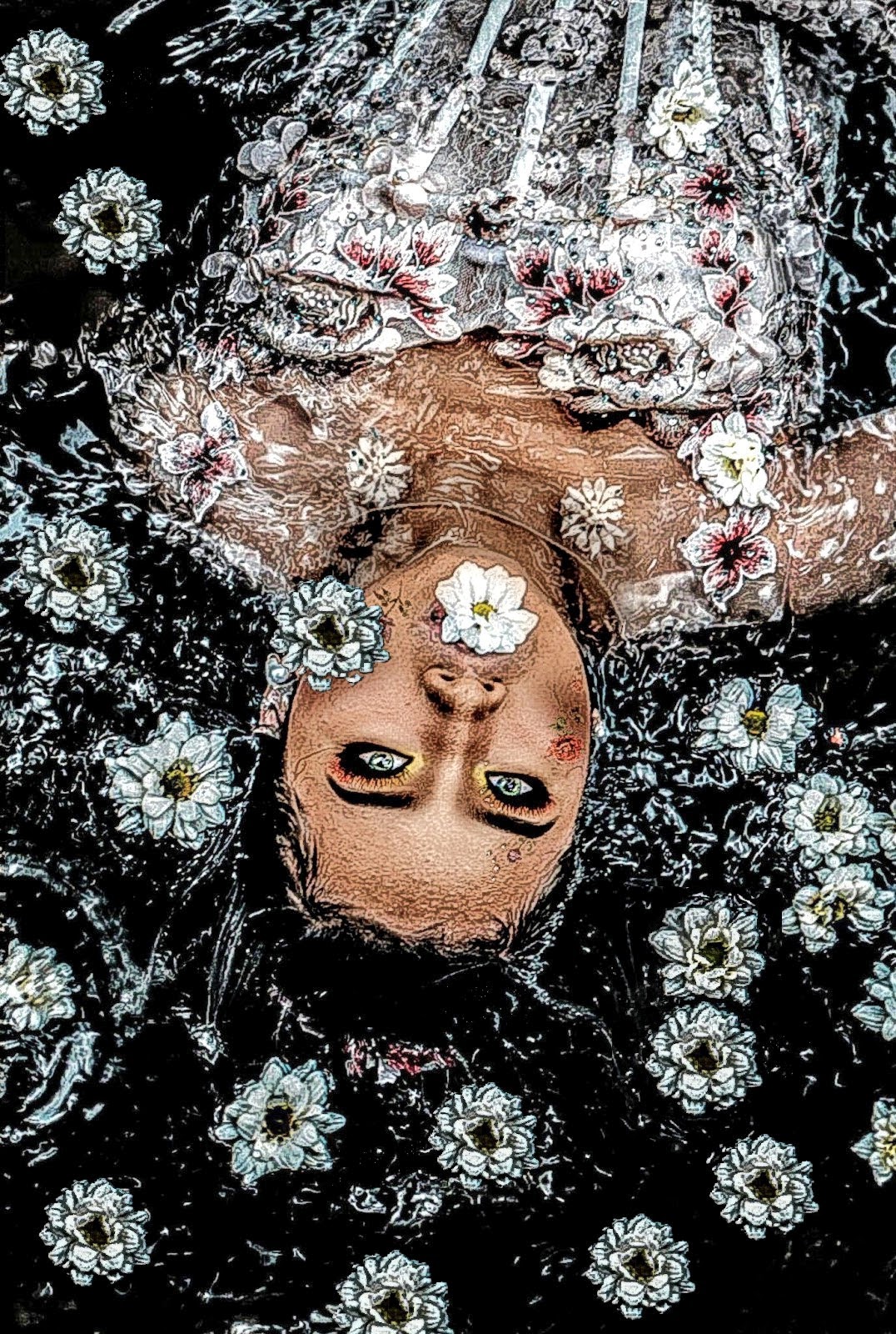 The art piece features a beautiful young coloured woman in a white dress covered in white flowers laying down on a black background with a few flower petals surrounding her.