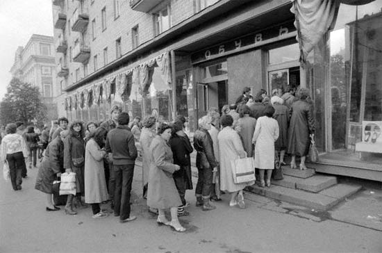 People stand in line to buy food in former Soviet Union