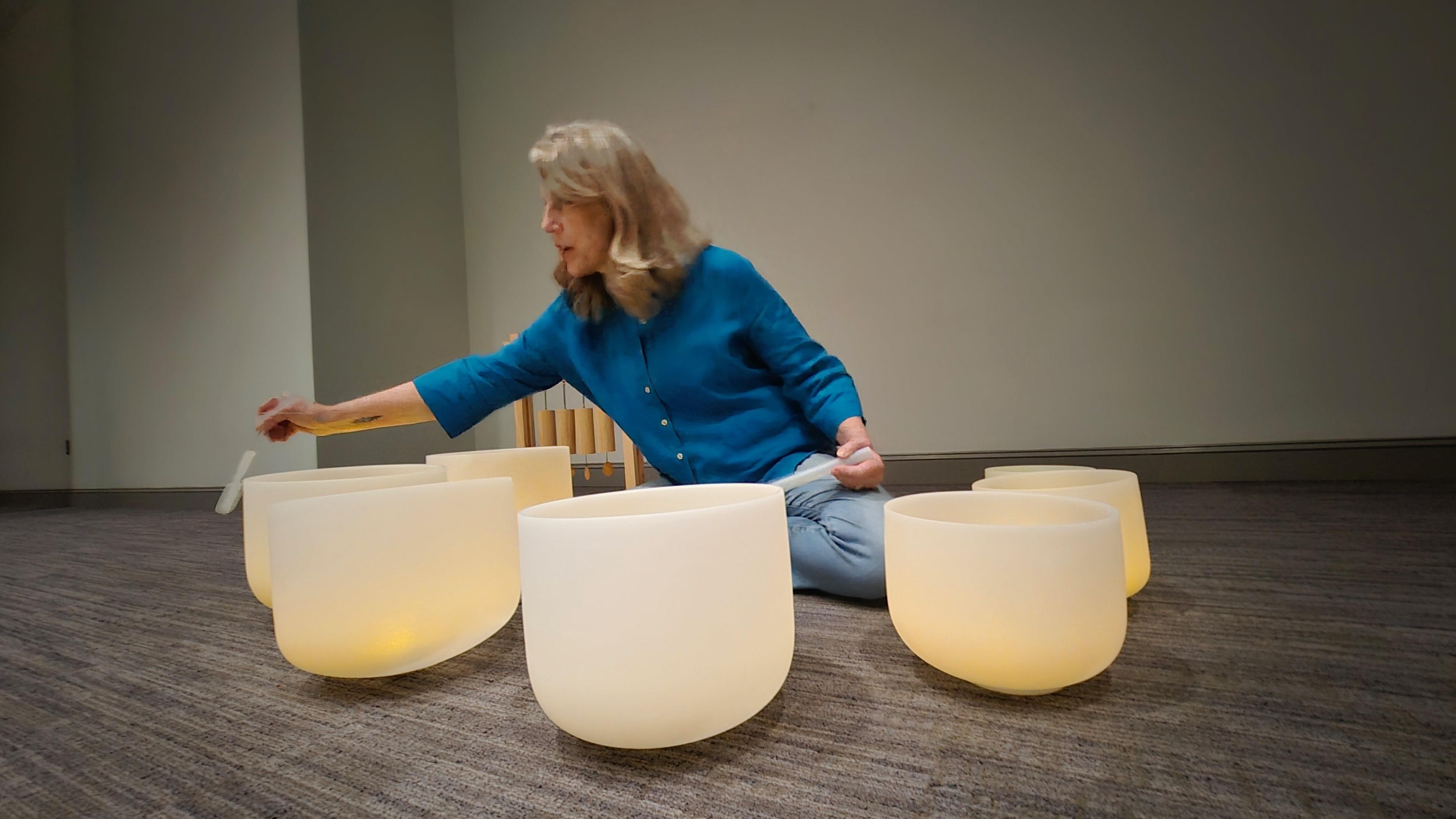 Julia with meditation bowls