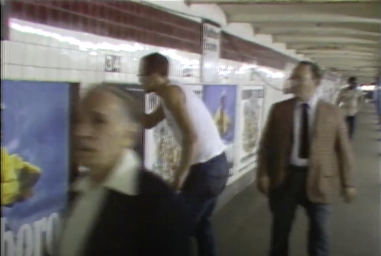 Haring creating art in a subway station, a still from the CBS video